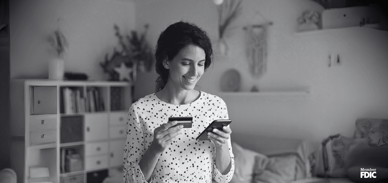 A woman checks her credit limit on her mobile banking app