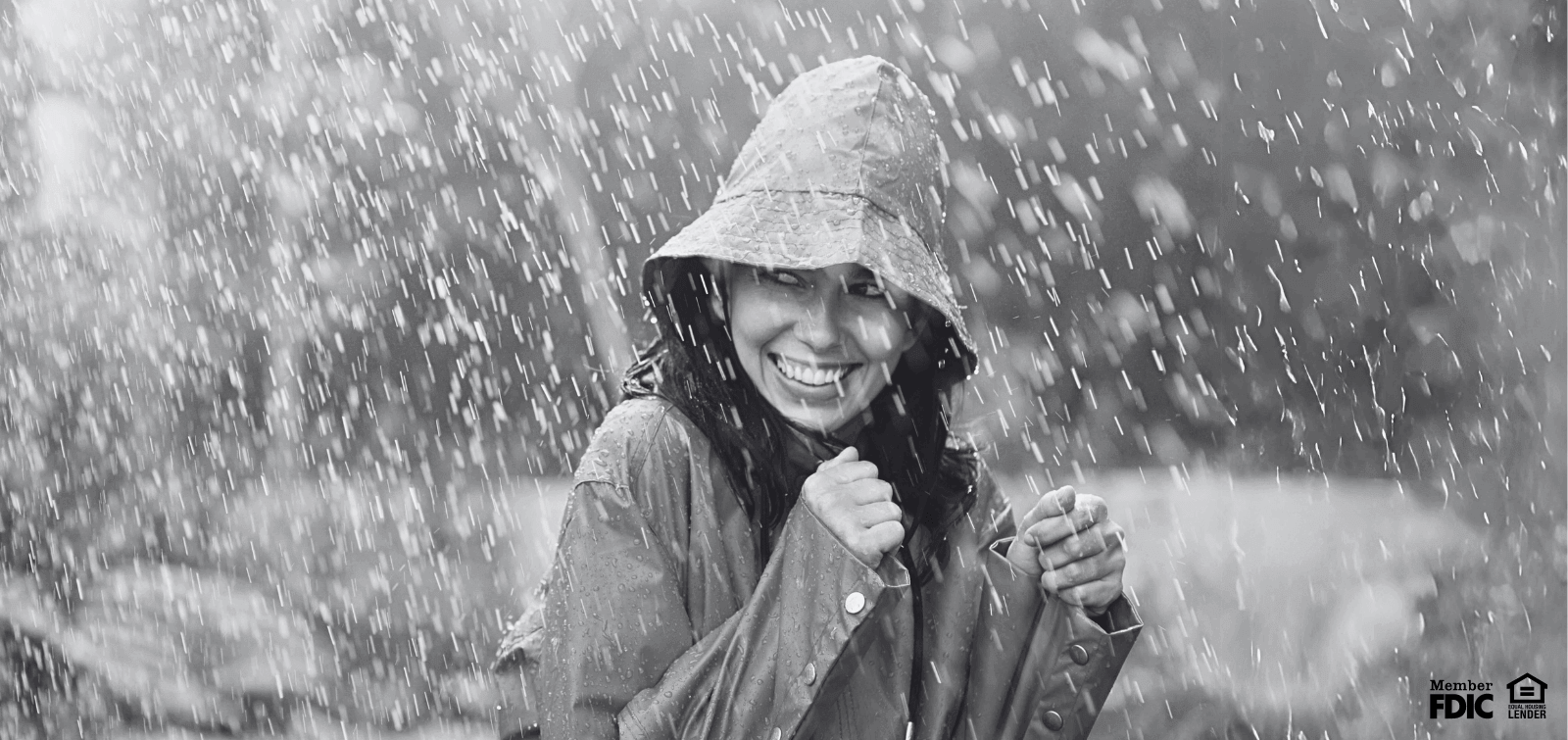 a young woman enjoys being outside on a rainy day.